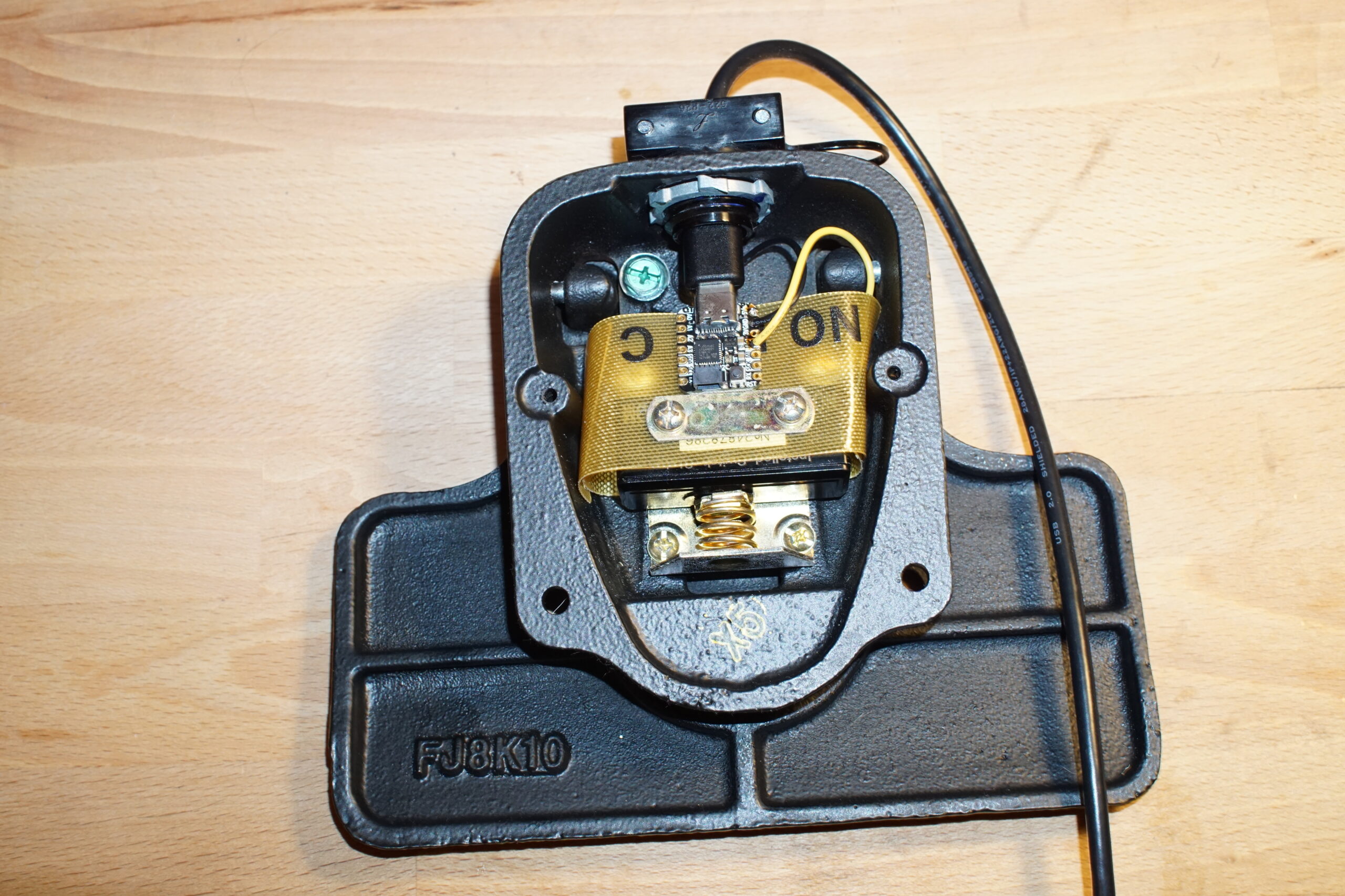 Image of footswitch internals with microcontroller connected.